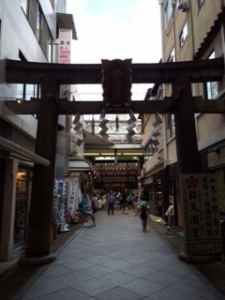 A "torii" which is a Japanese gate most commonly found at the entrance to a Shinto shrine. In this case, just another side street in the shopping plaza.